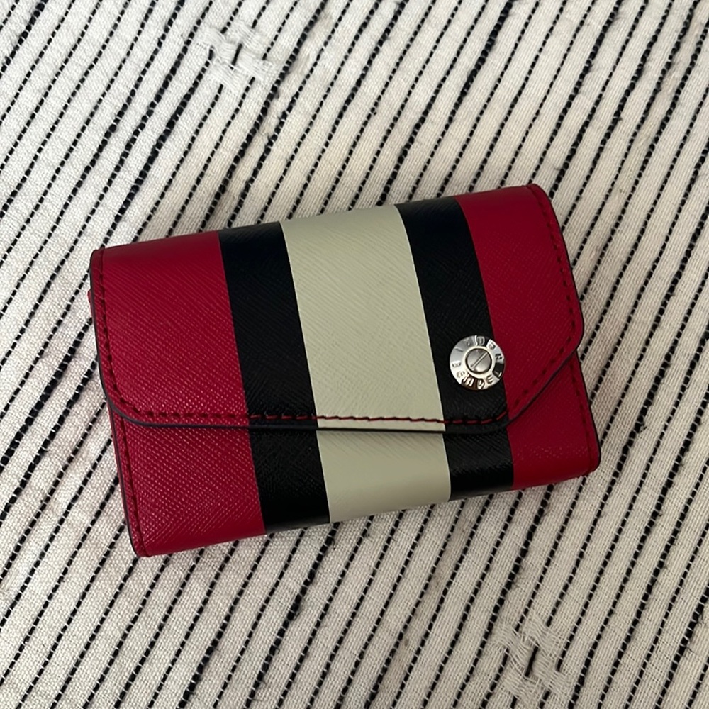 Henri Bendel business card case, like new condition except small tear in crease